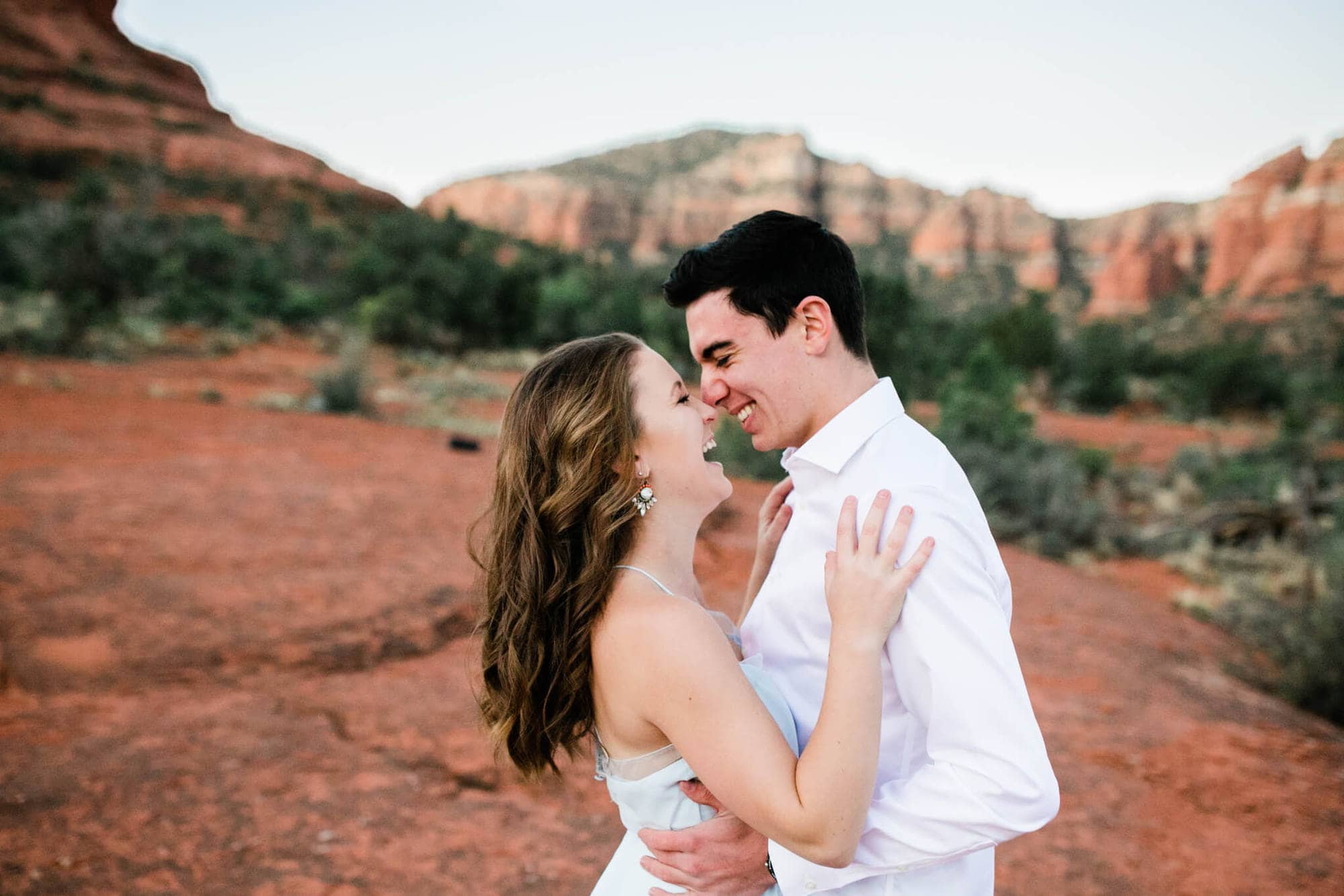 Having just eloped, the bride and groom laugh during their Sedona Adventure Wedding.