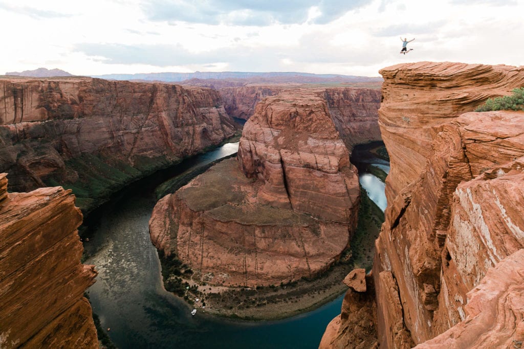 Michael jumps for joy on the edge of Horseshoe Bend