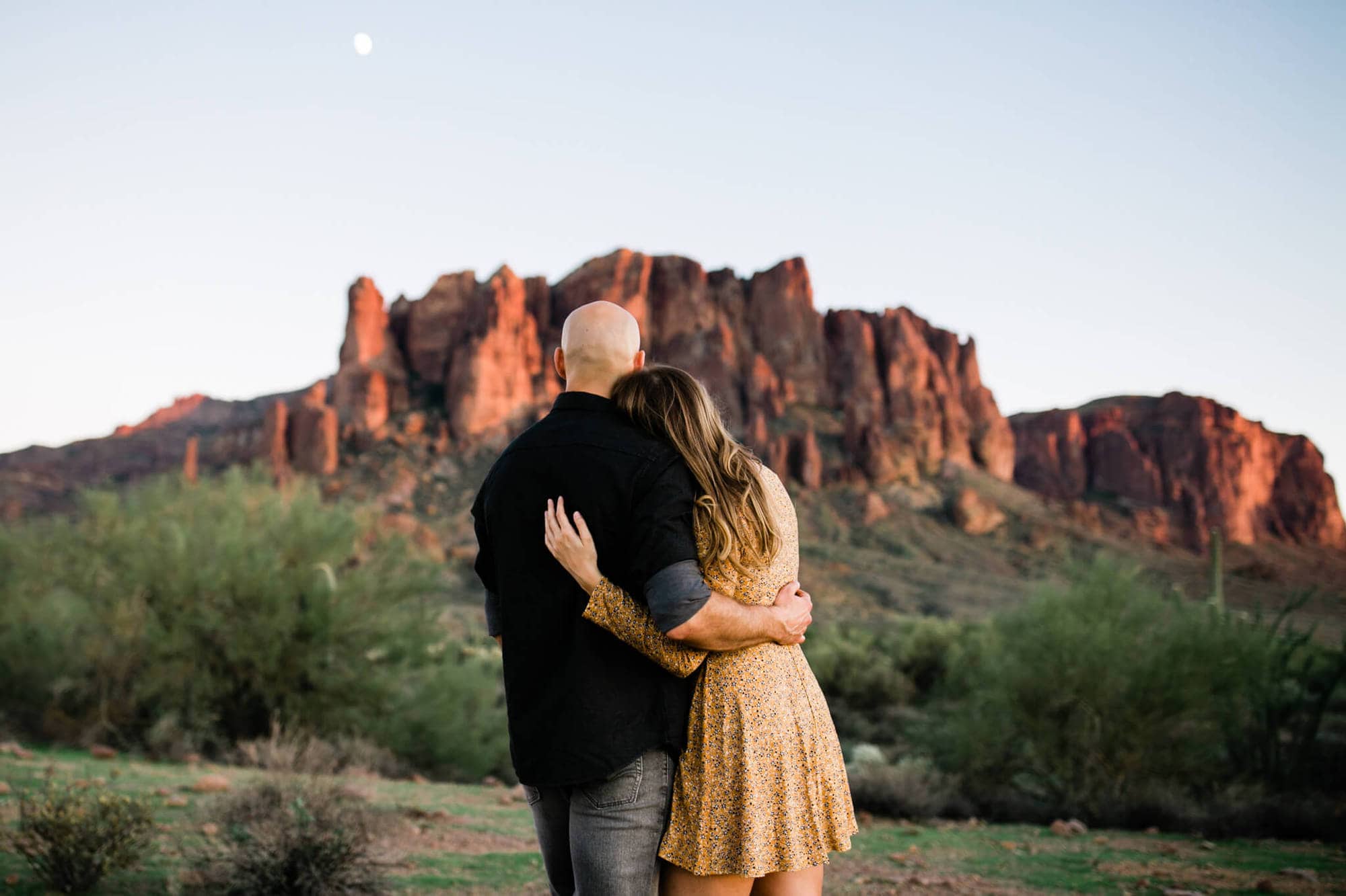Couple stands in Lost Dutchman State Park.