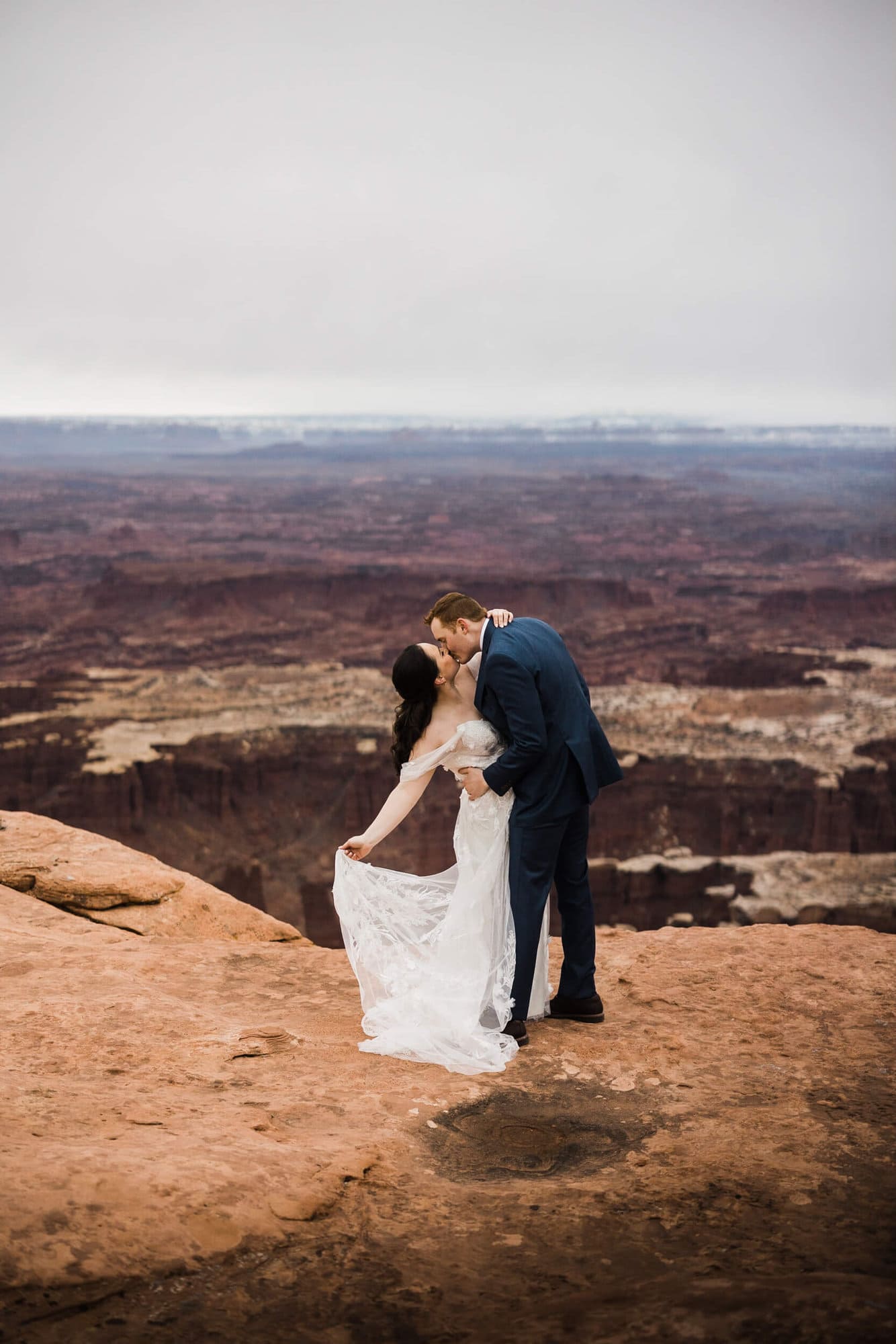 This couple totally embraced the This couple totally embraced nature’s plot twist; weather. This Moab Micro Wedding shows embracing rain can create magic. 
