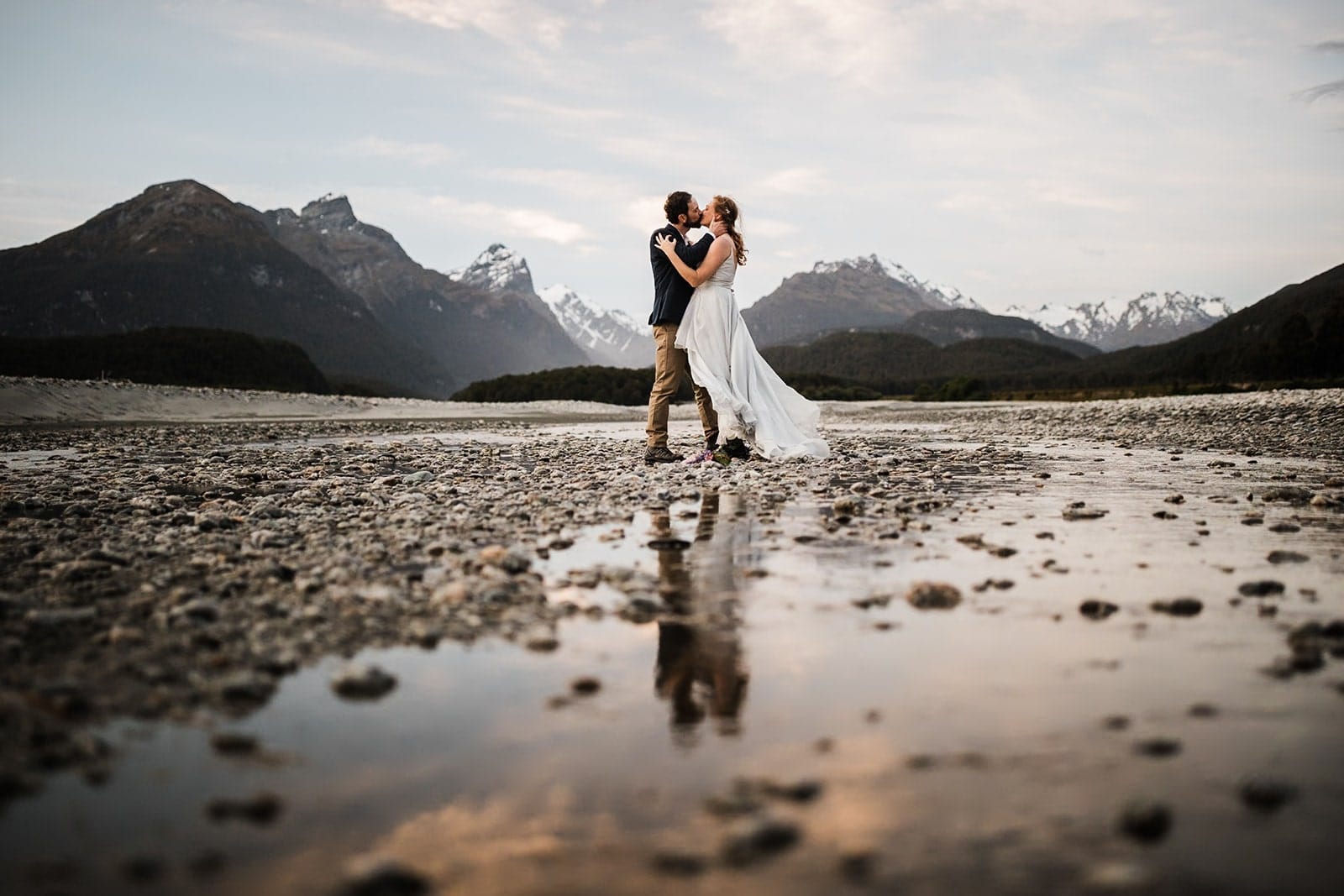 Bride and groom kiss during their Queenstown elopement in New Zealand