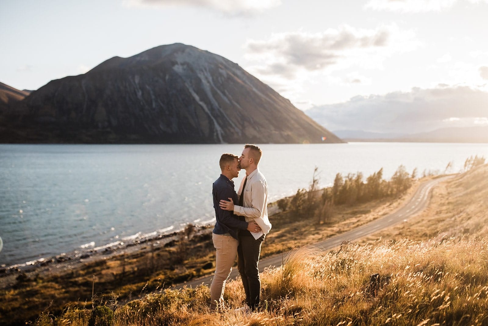 Two men kiss during their adventure photos in New Zealand