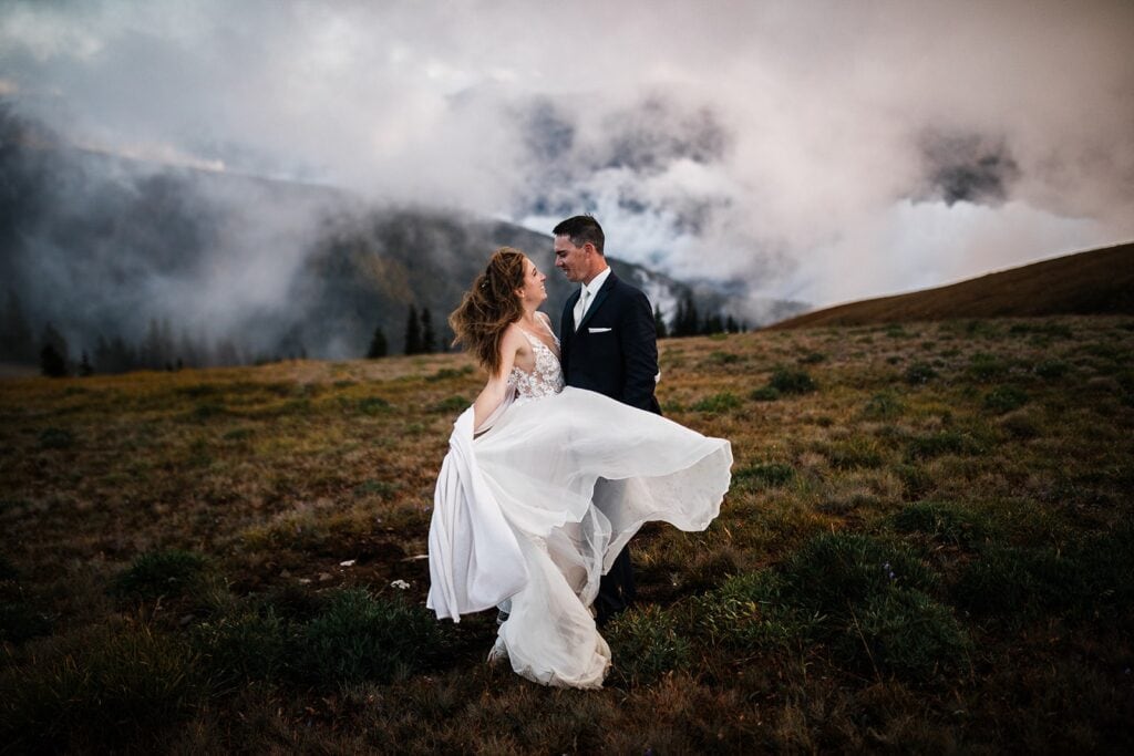 Wind whips bride's dress during elopement photos at Hurricane Ridge