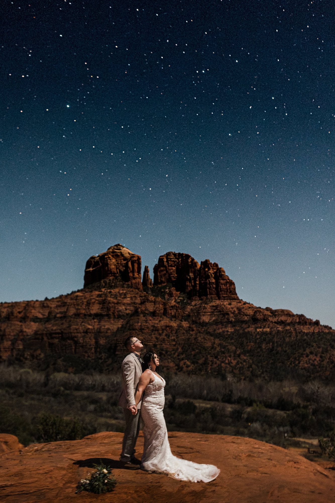 newlyweds soaking in the milky way in sedona, one of the most iconic places to elope in arizona.