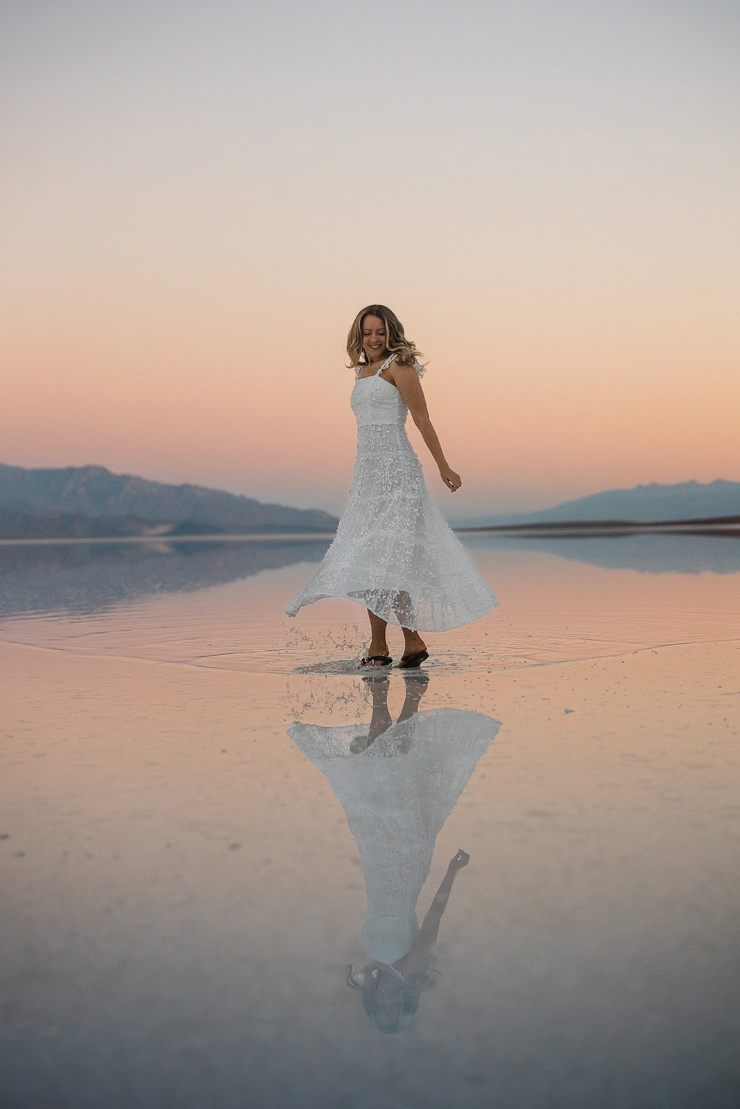 bride dancing in Lake Manly in Death Valley.