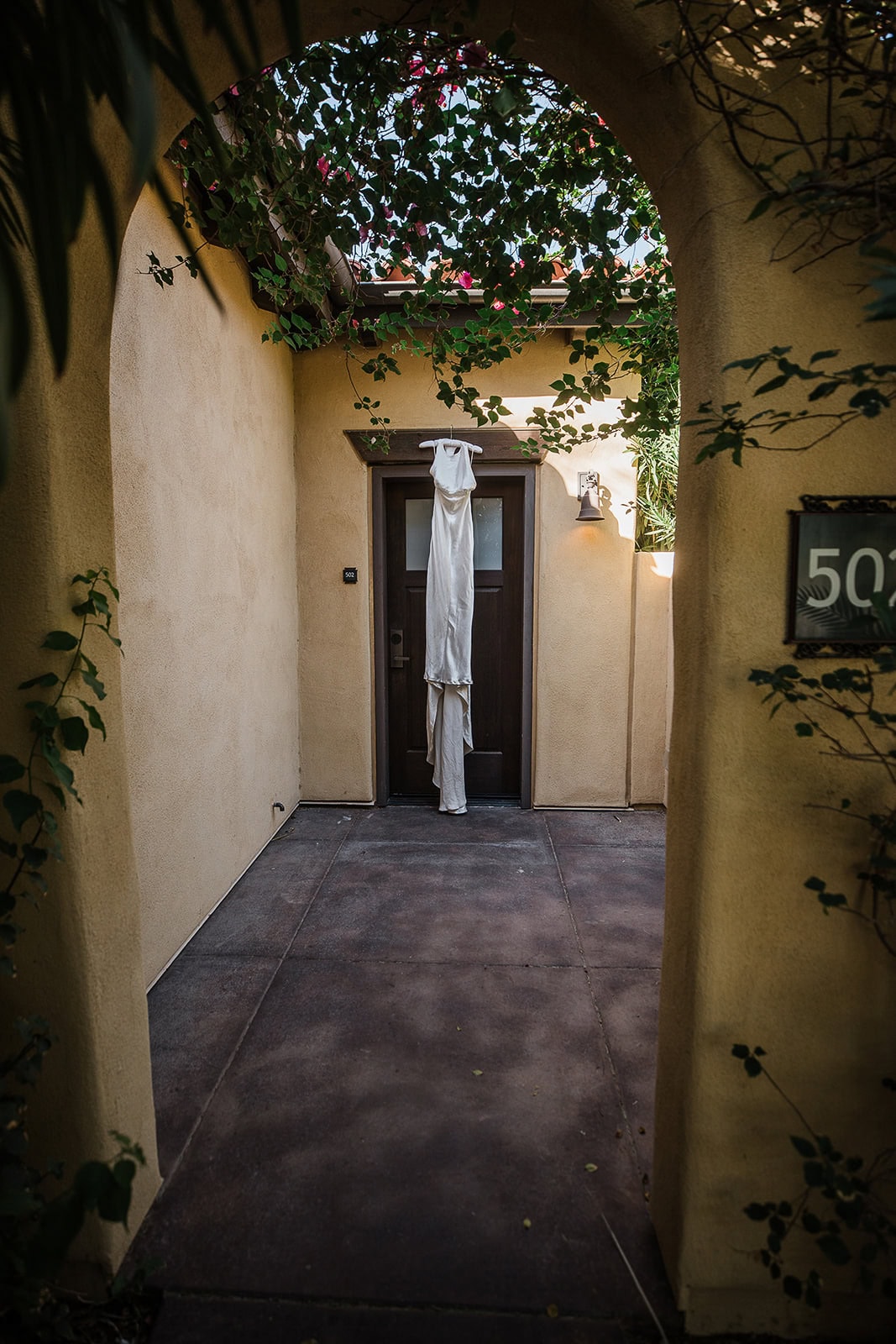 a bride's dress handing from a doorframe in death valley.