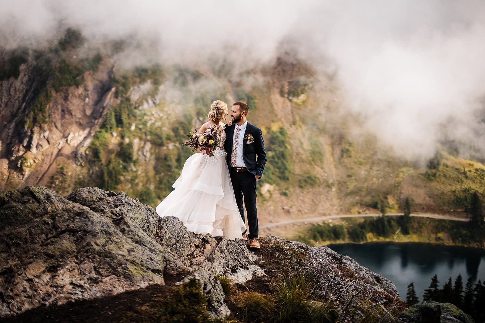 newlyweds holding each other close on a foggy washington day as they elope in Washington.