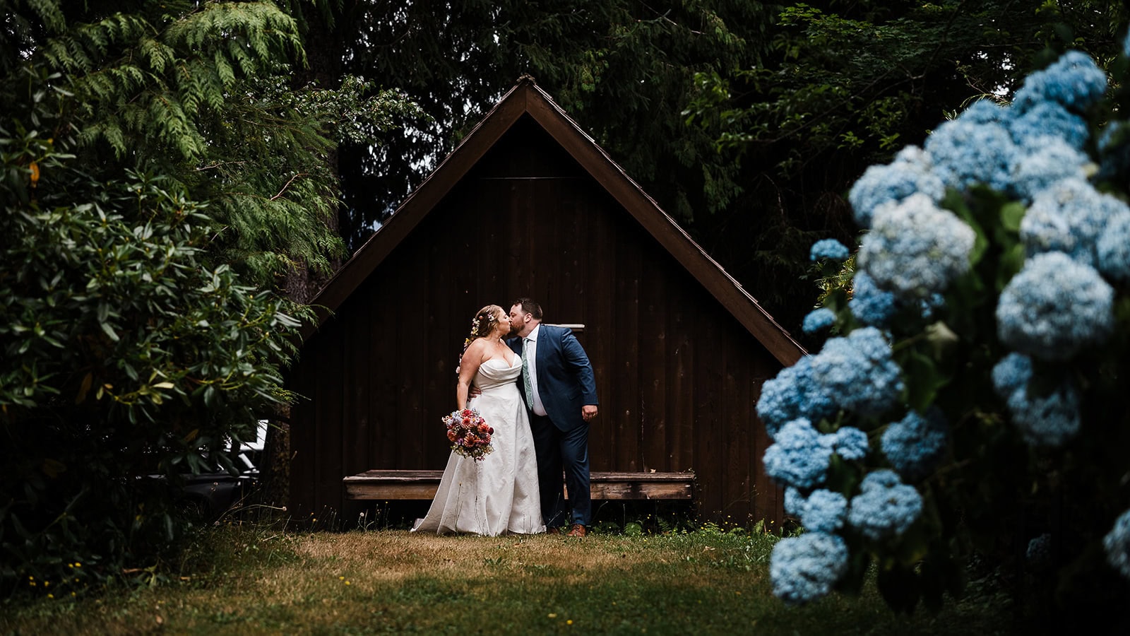 newlyweds kissing in front of their airbnb, an expense you consider when answering the question "how much does it cost to elope"?