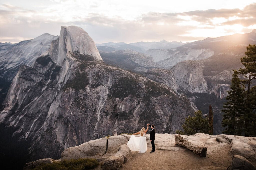 newlyweds dancing at glacier point, one of the best Yosemite wedding locations.