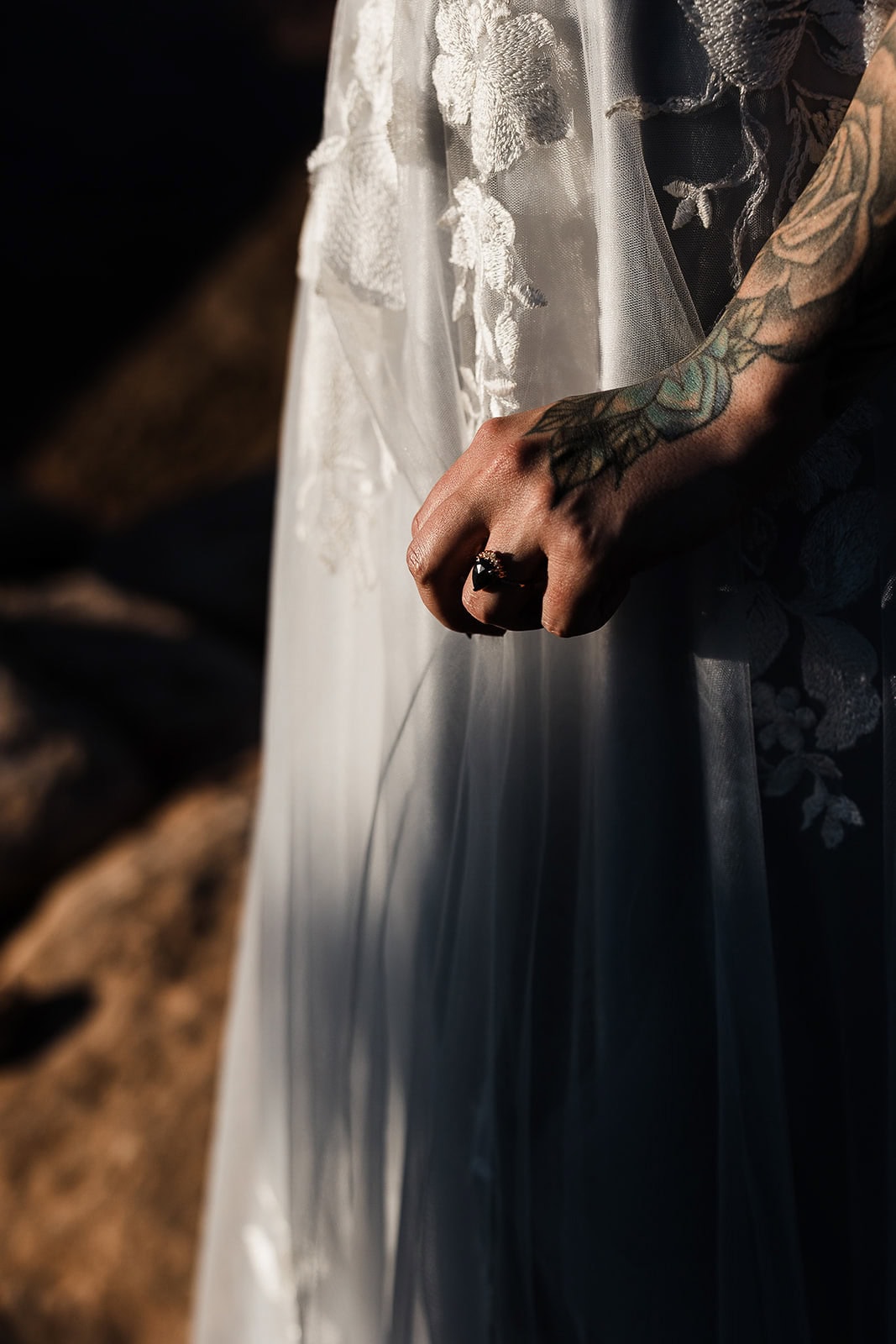 the bride showing off an engagement ring.