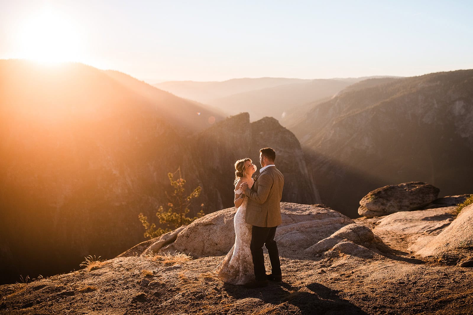 Newlyweds Dancing on taft point during their Yosemite micro wedding.