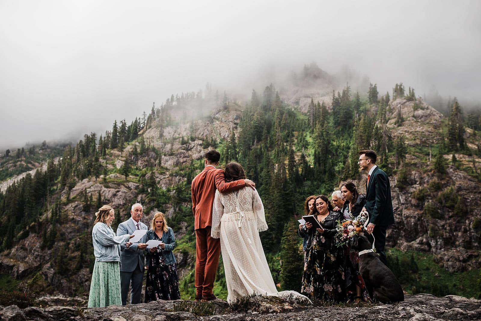 newlyweds hugging during their elopement ceremony in the mountains. 
