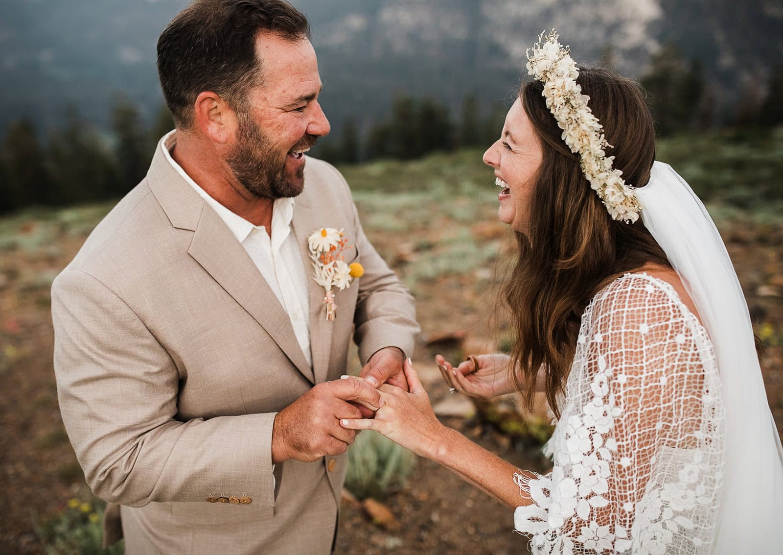 Newlyweds holding hands during their elopement ceremony.