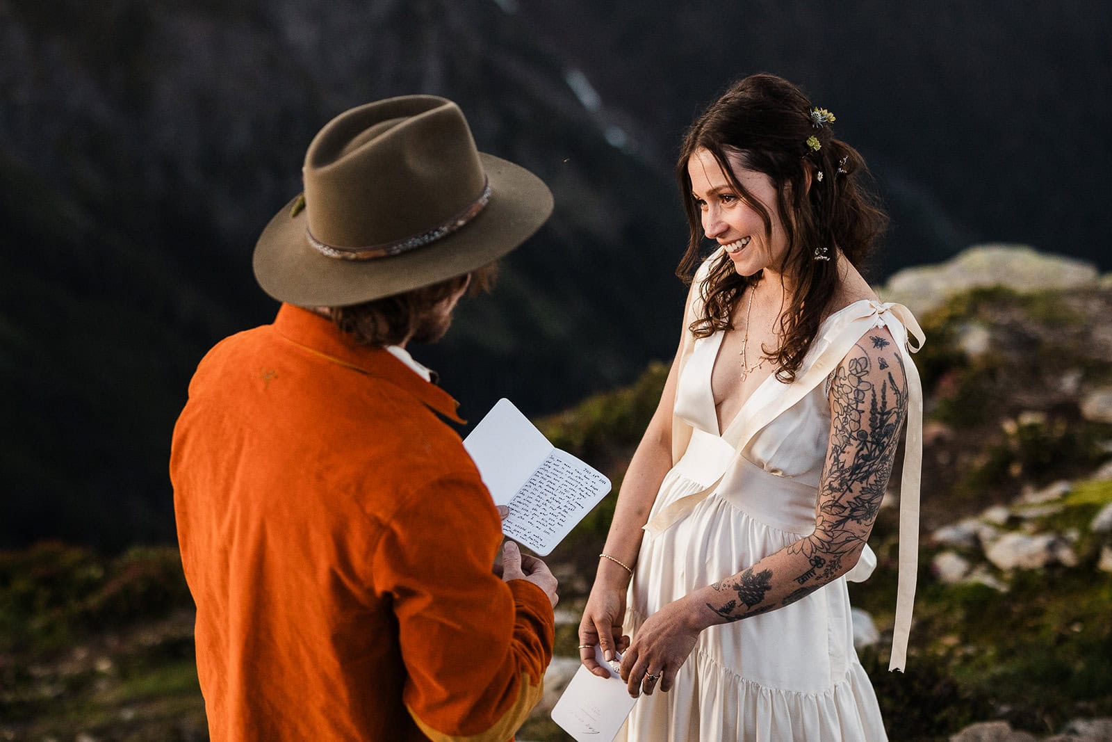 newlyweds exchanging handwritten notes during their elopement ceremony.